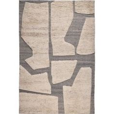 an area rug with various shapes and colors on it, including greys and beiges