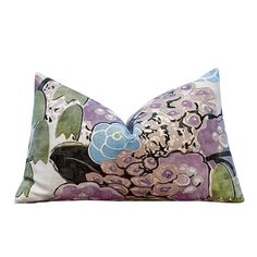 a purple and green pillow with flowers on it