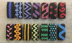 six rows of bracelets with different colors and designs on each one, all made out of plastic beads