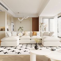 a living room filled with white furniture and lots of windows