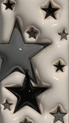 an abstract image of five black stars on a white and gray background, with one star in the center