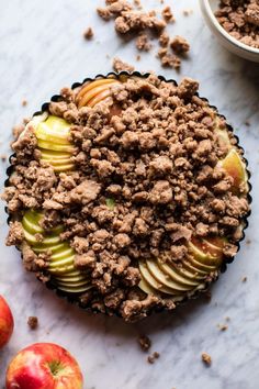 an apple pie sitting on top of a white counter