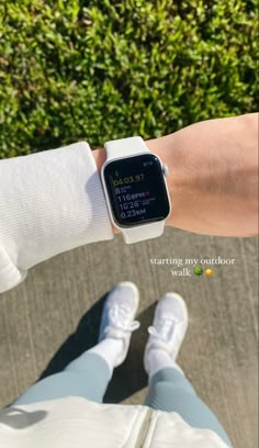 a person wearing an apple watch on their wrist with the time displayed in front of them