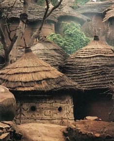 an old village with thatched roof houses