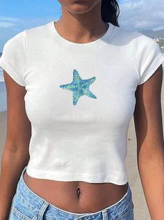 Discover the hidden beauty of the ocean with our starfish baby tee. Perfect for any beach lover or nature enthusiast, experience the calming energy of the sea wherever you go. Colors: For color options, please refer to the listing images. Size Options: Refer to the listing images for detailed size and color options. This T-shirt usually runs true to size. Printing Method: Features DTF (Direct to Film) printing, using a heat-press mechanism for high-quality, long-lasting designs that remain vibrant over time. Care Instructions: Turn the T-shirt inside out before washing Machine wash cold with mild detergent Tumble dry on very low heat Avoid bleach and do not iron directly on the design Our garments are pre-shrunk during the dye and wash processes to reduce shrinkage at home. Nature Enthusiast, Coastal Aesthetic, Beach Tee, Hidden Beauty, Beach Lover, Film Prints, Retro Summer, Beach Baby, Baby T Shirts