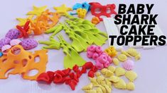 baby shark cake toppers are laid out on a white surface with the words, baby shark cake toppers