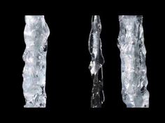 three pieces of ice that are standing in the air with water coming out of them