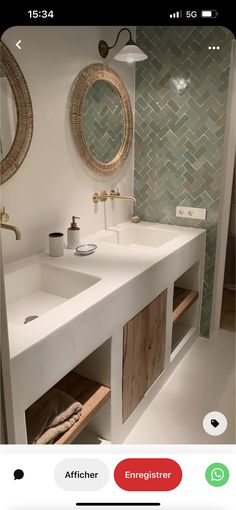 a bathroom with two sinks and mirrors on the wall