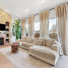 a living room with couches and a fireplace