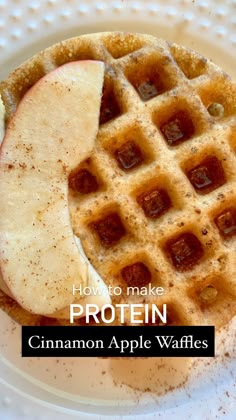 a waffle on a plate with cinnamon apple slices in the middle and text overlay how to make protein