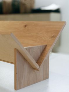 a wooden object sitting on top of a white counter