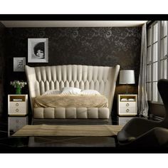 a bedroom with black walls and white furniture