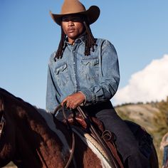 This premium Western shirt is constructed with triple needle stitching for toughness and has a classic, loose cut for riding and outdoor activity. It’s made from 100% cotton chambray, a soft, lightweight, and tough fabric that hangs well while keeping its shape and only gets better with age. Two snap-closure sawtooth pockets, a spread collar, and a two-point curved back yoke give this button-down the perfect dose of character. Iconic Western details include Stetson-branded turquoise snap buttons Roping Cattle, Printed Denim Shirt, Theme Photoshoot, Blue Denim Shirt, Western Denim Shirt, Country Theme, Denim Shirt Men, Denim Shirts, Denim Boots