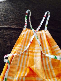 an orange and white checkered dress with straps