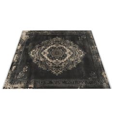 a black rug with an ornate design on the top and bottom, in front of a white background