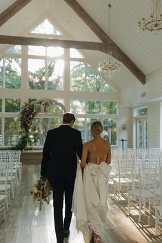 the bride and groom are walking down the aisle