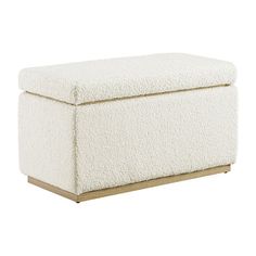 a white ottoman with a wooden base