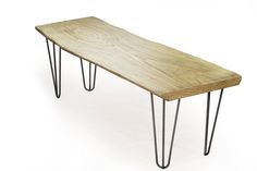 a wooden bench with hairpin legs on an isolated white background for use as a coffee table