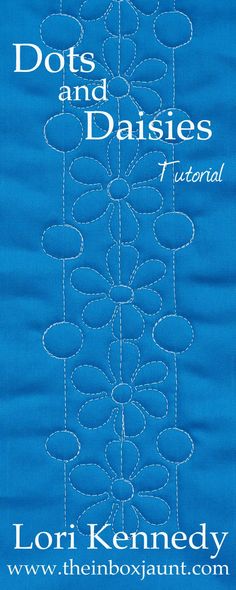 a blue book cover with the words dots and daisies on it