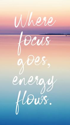 the words where focus goes, energy flows are written in white on a blue and pink background