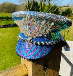 Dennis is a Genuine military Dress hat . Hand covered and decorated in beautiful sequins and gems . It is custom made to size so please forward your hat size with order and takes 3 weeks for delivery . We can also add letters or numbers to the front for an extra £15 for that special occasion or party 🎉  Dennis also has two other colour option shown in the shop . Luxury Blue Hat For Festivals, Multicolor Beaded Party Hats, Embellished Party Cap, Handmade Multicolor Costume Hats And Headpieces For Party, Custom Handmade Party Hat, Costume Hat With Rhinestones For Festivals, Military Dresses, Festival Hat, Sequin Fabric