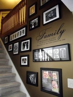 the stairs are decorated with family pictures and framed photographs