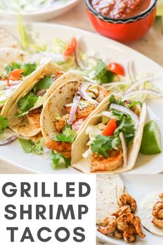 grilled shrimp tacos with lettuce, tomatoes and onions on a white plate