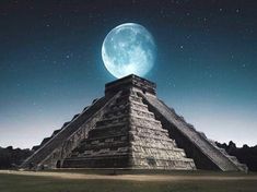 the moon is setting over an ancient pyramid