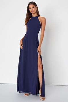 a woman in a long blue dress with a slit down the side and one leg