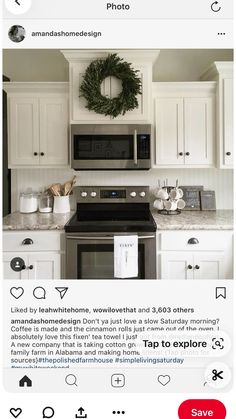 the kitchen is decorated for christmas with white cabinets and silver appliances, wreath on the wall above the stove