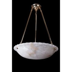 a light fixture with a white marble bowl hanging from it's center point, on a black background