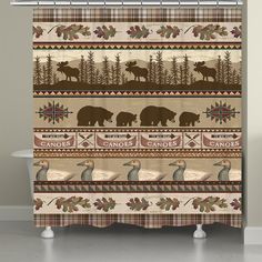 a shower curtain with bears and moose in the woods on it's side, next to a bathtub