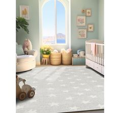 a baby's room with a large window and white rug