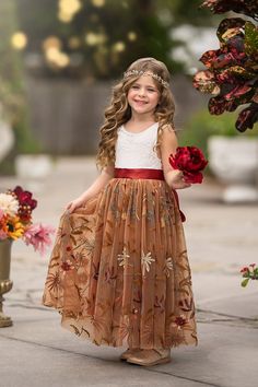 Sleeveless Floral Embroidered Burnt Orange Flower Girl Dress Elevate your little one's charm with our exquisite Sleeveless Floral Embroidered Burnt Orange Flower Girl Dress, the perfect choice for fall weddings. This dress is designed to capture the essence of autumn with its stunning multicolor fall floral embroidery, delicately adorning a bridal-grade tulle skirt. Key Features:- Main Keyword: Flower Girl Dresses- Sleeveless Floral Embroidered Design: This flower girl dress features intricate floral embroidery, making it a standout piece for any special occasion.- Burnt Orange Tulle Skirt: The vibrant burnt orange tulle skirt adds a touch of autumnal elegance, perfect for fall weddings.- V-Shaped Eyelash Fringe Backside: A unique V-shaped eyelash fringe backside enhances the dress's sophi Woodland Flower Girl, Flower Girl Dresses Fall Colors, Fall Flower Girl Dress, Burnt Orange Flower Girl Dress, Orange Tulle Skirt, Orange Flower Girl Dress, Orange Flower Girl, Fall Flower Girl, Fall Flower Girl Dresses