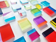 many different colored squares and rectangles on a white surface