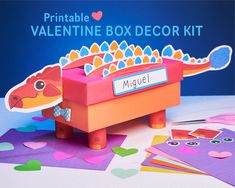 a valentine's day box decoration kit with a dragon in the middle and hearts around it