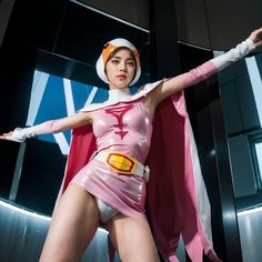 a woman in a pink costume is posing for the camera with her arms spread out