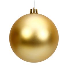 a golden christmas ornament hanging on a white background