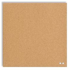 a cork board with two white dots on it