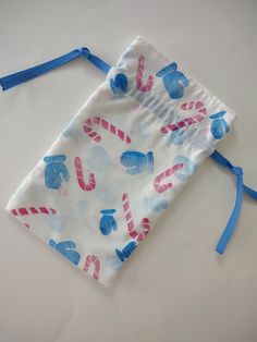 a drawstring bag with candy canes on it