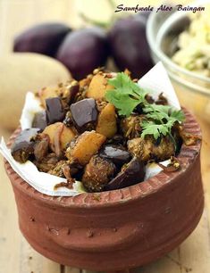 a bowl filled with food sitting on top of a wooden table