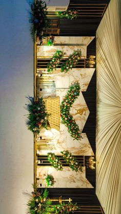 the interior of a restaurant decorated for christmas with greenery and decorations on the wall