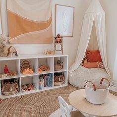 a child's playroom with toys, bookshelves and baskets on the floor