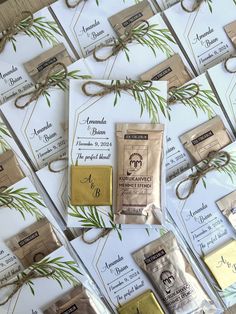 the wedding stationery is laid out on top of each other with twine ribbons