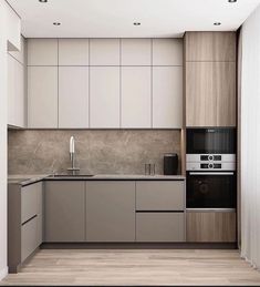 an empty kitchen with white cabinets and wood flooring