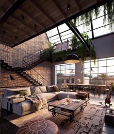 a living room filled with lots of furniture and plants hanging from the ceiling above it