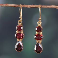 Sublime garnet gems dazzle the eyes in these dangle earrings presented by Alok Jain. Indian artisans show their talent by crafting this elegant accessory, featuring natural gemstones in a faceted finish that totals six carats, all arranged in 22k gold-plated structures that glamorously embrace each jewel. Cupid's Bow, Man Hand, Faberge Jewelry, Garnet Gem, Garnet Earrings, Elegant Accessories, Dream Jewelry, 22k Gold, Earrings Dangle