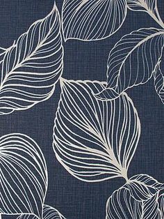 a blue and white wallpaper with leaves on it