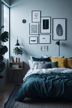 a bed sitting in a bedroom next to a window with pictures on the wall above it