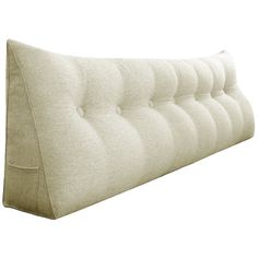 an upholstered headboard with buttons on the bottom and back ends, in beige linen